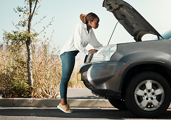 Image showing Mechanic, broken car and black woman in the road fixing her engine problem or emergency. Transportation, travel and young African female person checking her motor vehicle for accident in the street.