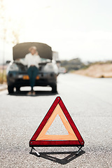 Image showing Car problem, stop sign or driver with stress or anxiety late from engine crisis on road or street. Blur, phone call or frustrated black woman talking by a stuck motor vehicle in emergency or accident