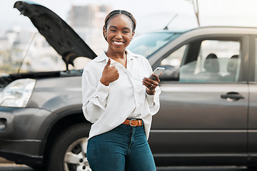 Image showing Car insurance, mobile or portrait of happy woman with thumbs up on road typing message for help. Smile, phone service or African driver by a stuck motor vehicle texting on social media or online