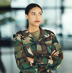 Image showing Military, thinking and arms crossed with a woman soldier in uniform for safety, service or patriotism Army, idea and a serious young war hero looking confident or ready for battle in camouflage