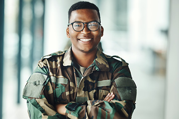 Image showing Portrait of soldier with smile, confidence and pride at army building, arms crossed and happy professional. Military career, security and courage, black man in camouflage uniform at government agency