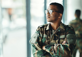 Image showing Confident soldier thinking, mockup and arms crossed in army building, pride and professional hero service. Military career, security and courage, black man in camouflage uniform at government agency.