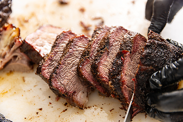 Image showing Chef cutting beef on board