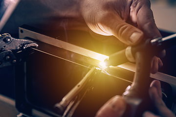 Image showing Metal welder works with a steel welder