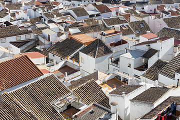 Image showing Aerial panoramic view of rooftops of white houses of Olvera town, considered the gate of white towns route in the province of Cadiz, Spain