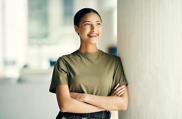 Image showing Woman soldier with smile, confidence and pride, relax outside army barracks with arms crossed. Professional military career, security and courage, girl in uniform and happy government agency service.