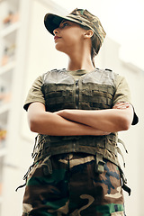 Image showing Army, thinking and arms crossed with a woman patriot in uniform for safety, surveillance or service. Military, idea and a serious young soldier looking confident or ready for battle in camouflage