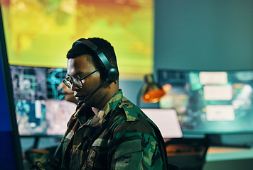 Image showing Military, control room and man on computer in office, data center and monitor for technical support, cybersecurity or surveillance. Army, officer and work in tech, security or government communicatio