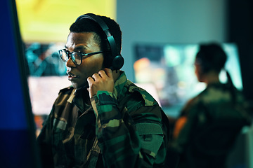 Image showing Military, control room and man on computer in office, data center and monitor for technical support, cybersecurity or surveillance. Army, officer or work in tech, security or government communication