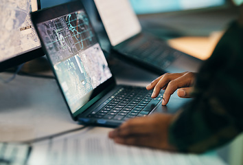 Image showing Hands typing, laptop and closeup on table of military intelligence, map and research on internet. Computer, soldier and veteran online for surveillance, cyber security and info of army professional