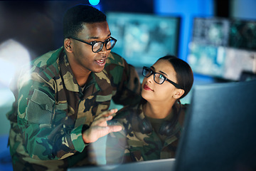 Image showing Night training, army and people with a computer for communication, planning strategy or surveillance. Cyber security, data center and a black man talking to a woman about monitor in a military room