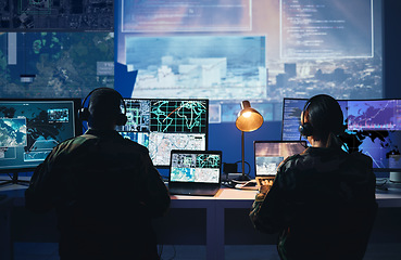 Image showing Military control room, computer screen and team with surveillance, headset and tech communication from back. Security, satellite map and man with woman at monitor in army office at command center.