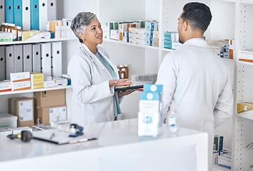 Image showing Pharmacy people, communication and team discussion on healthcare inspection, quality assurance or medical inventory. Service teamwork, consulting and pharmacist cooperation on hospital clinic storage