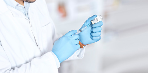 Image showing Hands, healthcare a vaccine with a doctor in the hospital closeup for treatment or cure using a syringe. Medical, needle and injection with a medicine professional in a clinic for pharmaceutical care