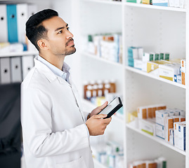 Image showing Man in pharmacy with tablet, checklist and stock for medicine with online web info. Pharmacist, digital app and inventory search on internet with check for pharmaceutical drugs, tech or healthcare.