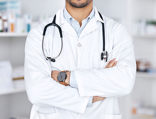 Image showing Healthcare pharmacy, arms crossed and person confident in retail service, hospital clinic and medical support. Wellness, medicine expert and pharmacist for pharmaceutical, supplements and doctor