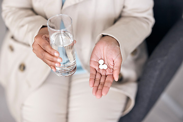 Image showing Water, medicine and pills with hands of person for healthcare, prescription and supplements. Medical, pharmacy product and wellness with closeup of woman and glass for vitamins, sick and treatment