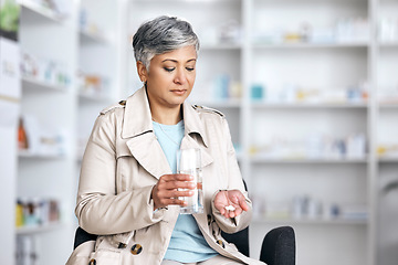 Image showing Pharmacy, medicine and pills with senior woman in store for healthcare, prescription and supplements. Medical, product and wellness with customer and prescription for vitamins, sick and treatment