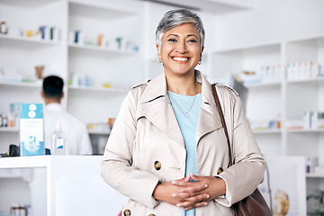 Image showing Pharmacy, store and woman customer in portrait for healthcare, medicine and happy services. Face of mature person for clinic or medical support and information at desk or counter for health shopping