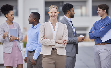 Image showing Business, portrait and woman with hands crossed for leadership and teamwork on rooftop of office building with collaboration. Team, people and professional employee in human resources and corporate