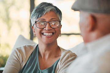 Image showing Conversation, smile and senior couple on a sofa for relaxing, communication or bonding together. Happy, love and elderly woman in retirement talking to her husband in the living room of modern home.