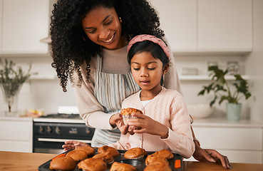 Image showing Kitchen, mom and kid, cupcake baking in house and eating together, happy with dessert in apartment. Child development, cooking sweet treats and bonding time, woman baker and girl in home with cake.