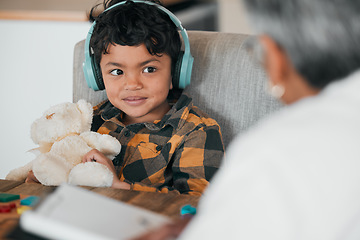 Image showing Education, headphones and teaching with child and grandmother for homework, helping and studying. Learning, happy and math with boy and woman in family home for assessment, exam and knowledge