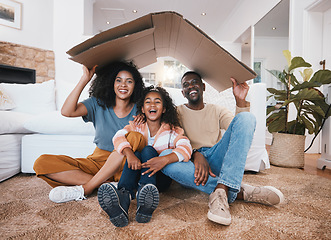 Image showing Family, roof and insurance, security and protection at home with parents, child and happy in portrait. People in living room, shelter and support with safety and love, real estate property with box