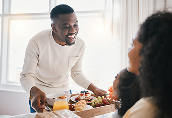 Image showing Mothers day, breakfast and family in bed with happy dad, mom and child together in home with love, care and brunch tray. Father, surprise and mom with girl and food in bedroom for special celebration