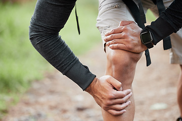 Image showing Knee pain, injury and person hand in park with fitness, workout and training accident from hike. Runner, leg massage and fail from trekking in the woods on a trail with muscle strain and emergency