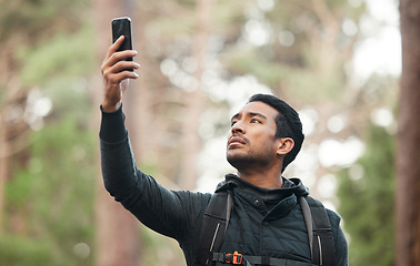 Image showing Phone, connection and man in nature for hiking, trekking and exercise in woods. Fitness, travel and person on smartphone lost with no signal for GPS, online location and digital map on adventure