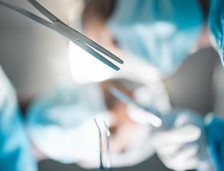 Image showing Healthcare, surgery tools and doctors in theatre for operation, emergency or risk with safety ppe at hospital. Medical, wellness and surgeon or professional nurse with metal equipment for injury