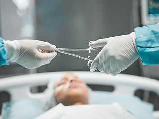 Image showing Healthcare, hands on tools and doctor in surgery with equipment, teamwork and support in hospital. Nurse helping medical surgeon, safety and patient in bed for operation, emergency procedure in ER.