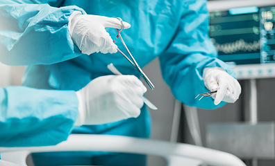 Image showing Surgery, hands on tools and doctor in cutting thread with scissors, teamwork and support in hospital. Nurse helping medical surgeon, safety and stitches in operation for emergency healthcare in ER.