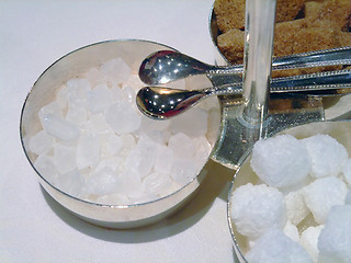 Image showing Candy sugar cubes with tongs