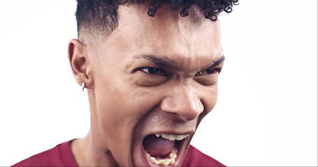 Image showing Angry, screaming and face of man on a white background for emotions, stress and frustrated in studio. Furious, mental health and isolated person shouting with rage for mistake, upset and crisis