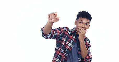 Image showing Hand pointing, mistake and scared man in studio with anxiety or mental health crisis on white background. Stress, horror and model guy afraid, fail or hiding from abuse, terror and accident or danger