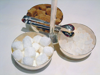 Image showing cane sugar, white sugar and candy sugar cubes with tongs