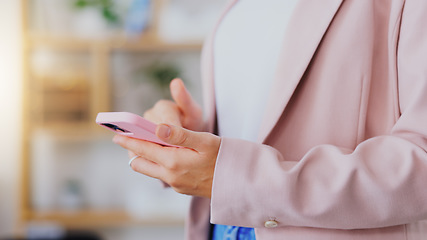 Image showing Business, woman and hands typing on smartphone in office, online app or contact technology. Closeup of female worker texting on pink cellphone for networking, notification and mobile media connection
