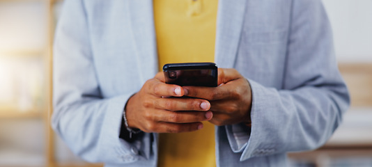 Image showing Business, man and hands typing on smartphone in office, online user and contact technology. Closeup of employee texting on cellphone for networking, mobile app notification or social media connection