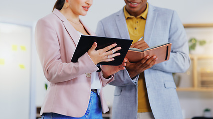 Image showing Tablet, notebook and business people in discussion in the office doing research for a project. Collaboration, teamwork and corporate team working on a report together with mobile device in workplace.