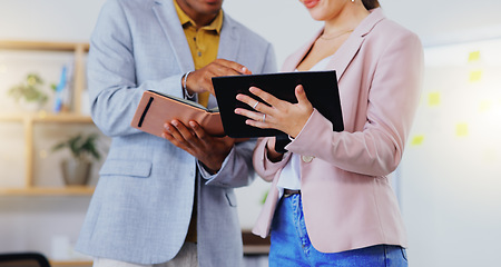 Image showing Tablet, notebook and business people in discussion in the office doing research for a project. Collaboration, teamwork and corporate team working on a report together with mobile device in workplace.