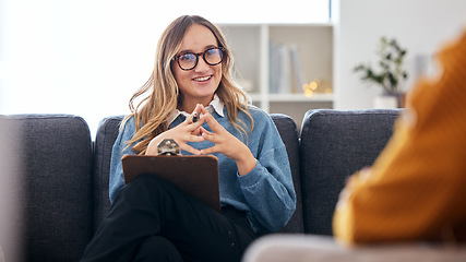Image showing Therapist on sofa with notes, listening to patient in therapy and advice in psychology for mental health care. Conversation, support and woman on couch with client, happy psychologist in counseling.