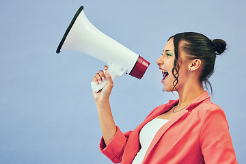 Image showing Megaphone, speech and woman shouting in studio with news, discount or beauty sale on blue background. Speaker, noise and female model with bullhorn announcement for cosmetic, giveaway or makeup prize