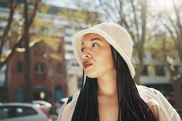 Image showing Woman, travel and fashion in city with thinking and freedom from urban adventure in New York. African teenager, streetwear and gen z clothes and outdoor on a journey in town on a trip in road