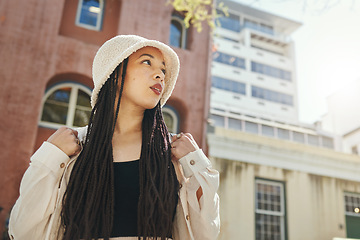 Image showing Woman, travel and gen z fashion in city with thinking and freedom idea from urban adventure in New York. Female teenager relax, streetwear clothes and student outdoor on a journey in town on a trip