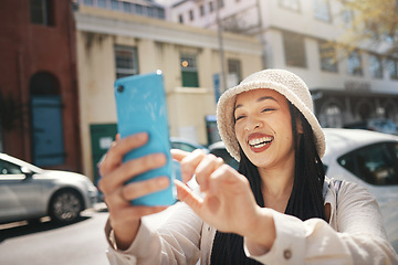 Image showing Happy woman on street with phone, live streaming in city and travel holiday blog for social media post. Influencer, streamer or gen z girl with urban fashion, smartphone and smile in content creation