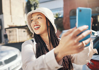 Image showing Happy woman in city with smartphone, travel blog and smile for live streaming on social media for holiday memory. Influencer, streamer or gen z girl with urban fashion, phone and content creation.