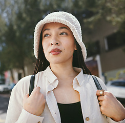 Image showing Woman, thinking closeup and gen z fashion in city with travle and freedom from urban adventure in New York. Female teenager relax, streetwear and backpack and outdoor on a journey in town on a trip