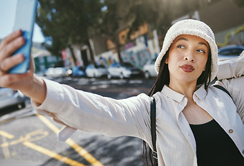 Image showing Woman on street with selfie in city, travel holiday memory and social media in streetwear. Influencer, streamer or gen z girl with urban fashion, photography and content creation for vacation blog.